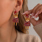 Aretes de renos con suéter