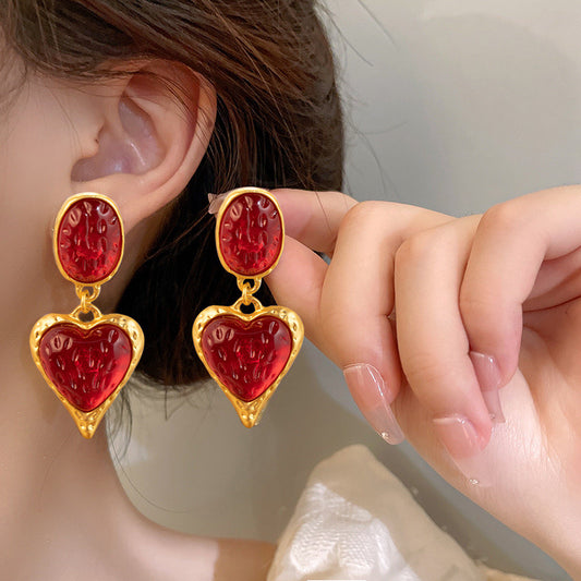 Aretes de corazones dorado y rojo
