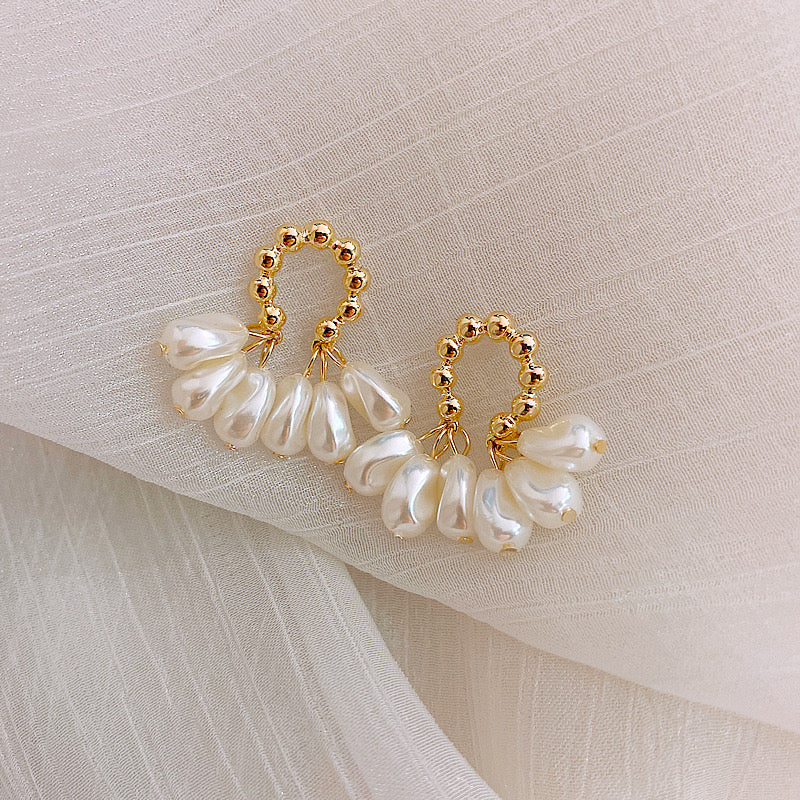 Aretes dorado y blanco