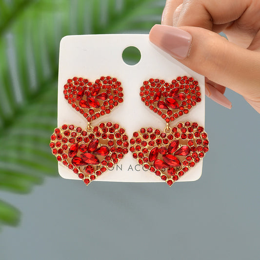 Aretes de corazones con pedreria roja