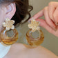 Aretes de flores doradas + carey acero inoxidable