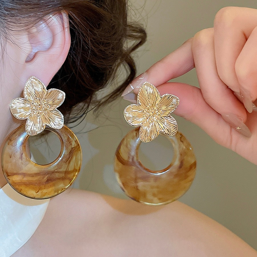 Aretes de flores doradas + carey acero inoxidable