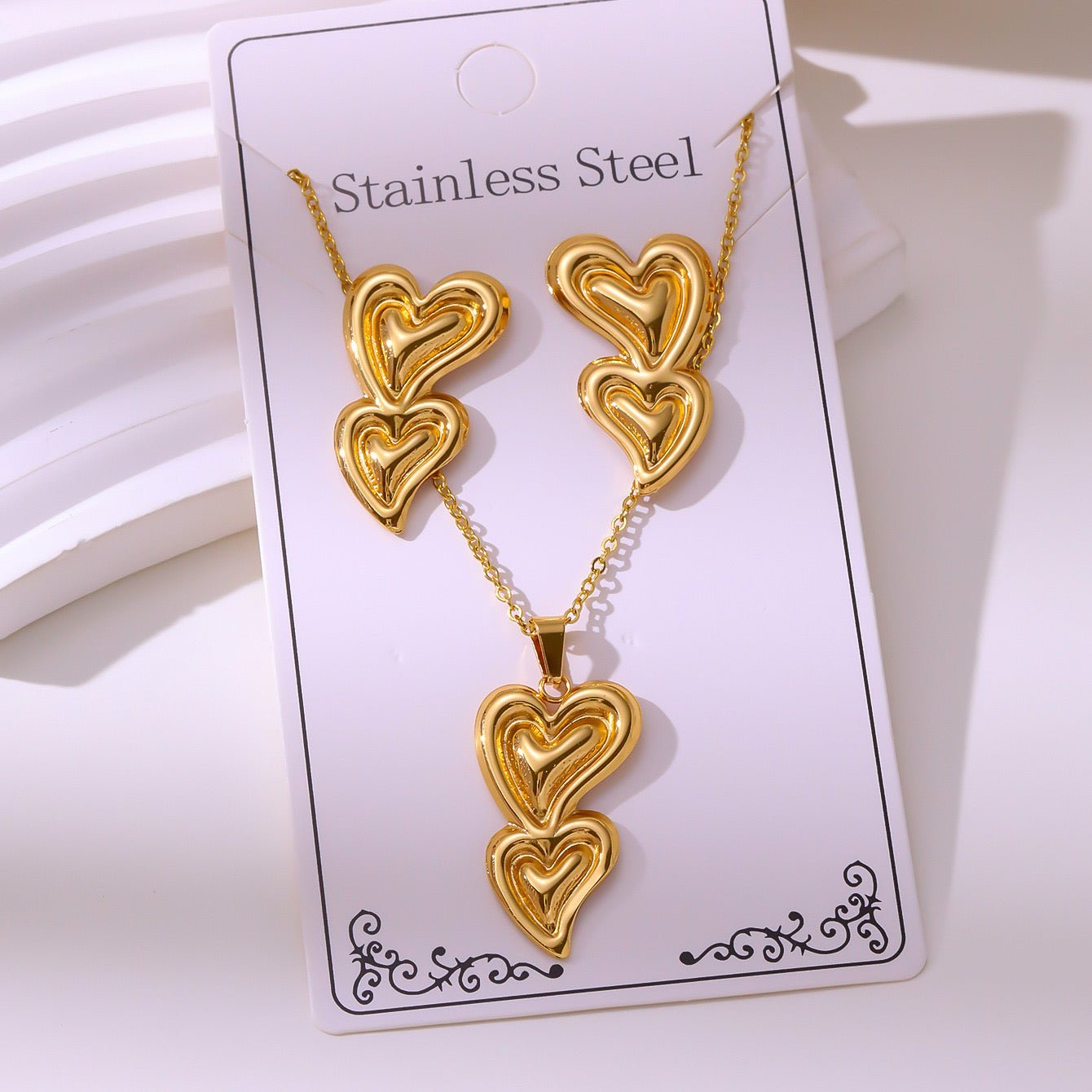 Set de collar + aretes doble corazón - acero inoxidable