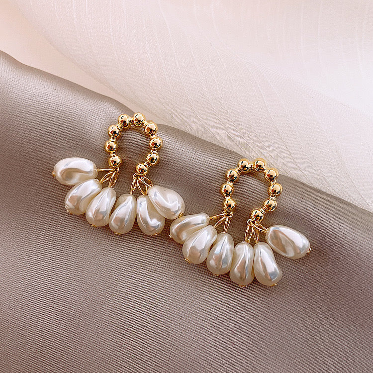 Aretes dorado y blanco