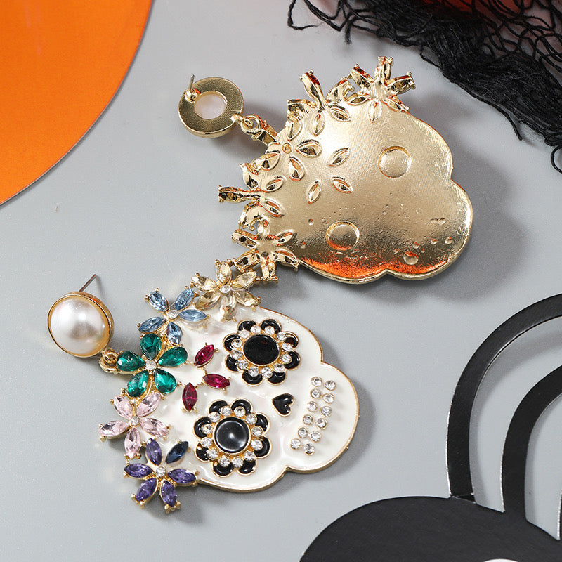 Aretes de calaveritas con pedrería
