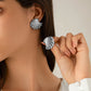 Aretes de abanicos plateados - acero inoxidable