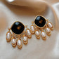 Aretes negros con perlas