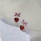 Aretes de corazón morados escarchados