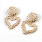 Aretes corazones dorados con textura