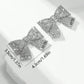 Aretes de moños plateados con pedrería