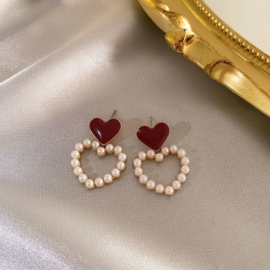 Aretes de Corazones pequeños con perlitas blancas