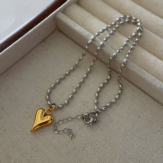 Collar plateado y corazón dorado- acero inoxidable