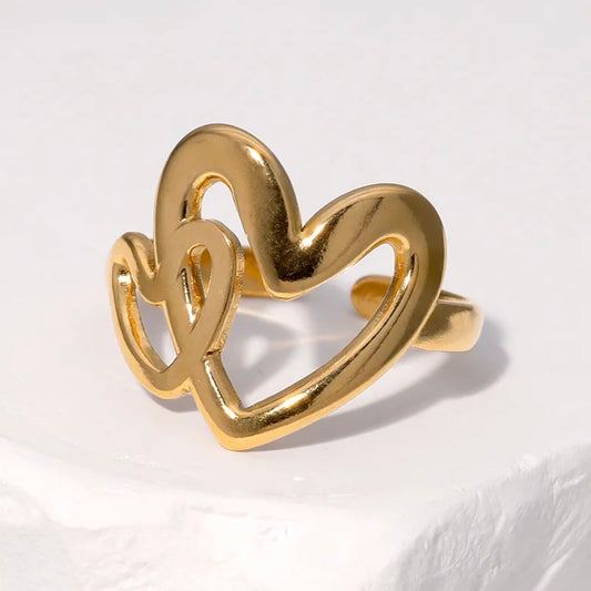 Anillo ajustable dos corazones dorado  / Acero inoxidable