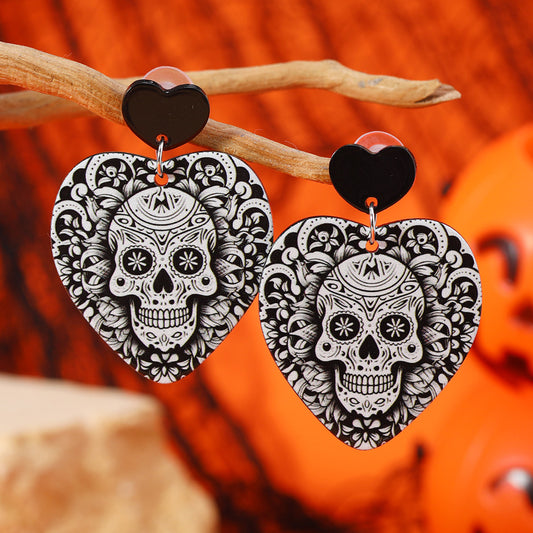 Aretes corazones con calaveras