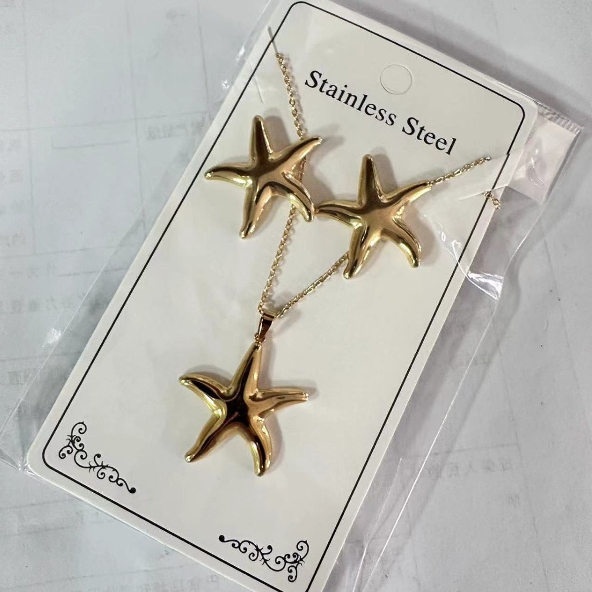 Set de collar + aretes estrella - acero inoxidable
