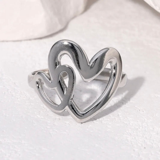 Anillo ajustable dos corazones plateado  / Acero inoxidable