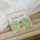 Aretes de mariposas verdes - acero inoxidable