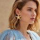 Aretes de estrellas doradas