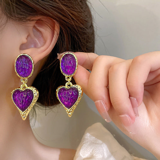 Aretes de corazones morados