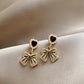 Aretes lazo corazón negro