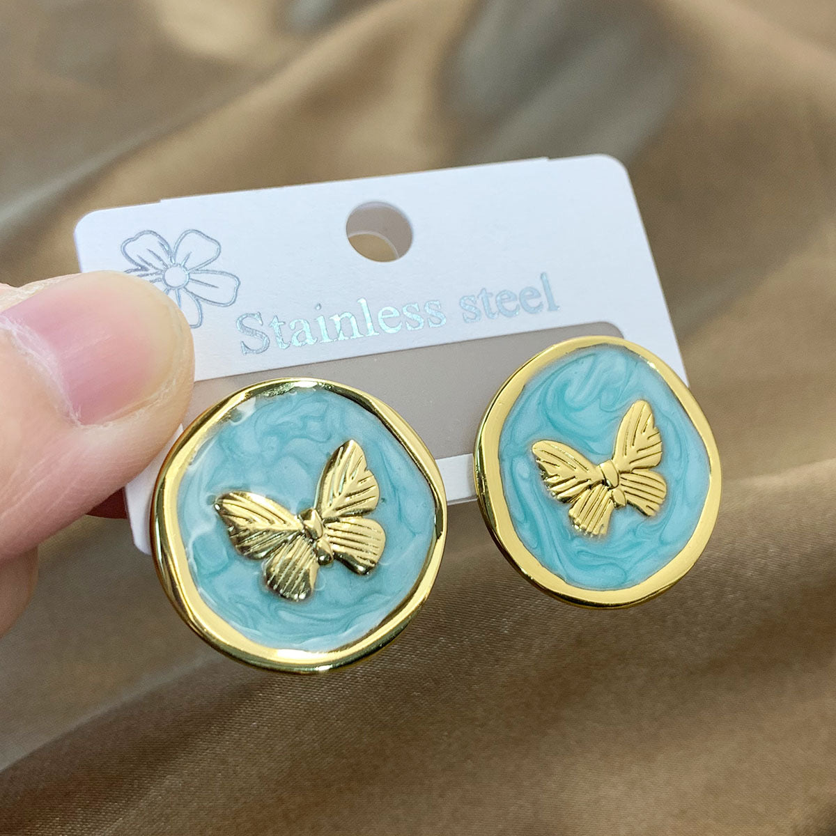 Aretes de mariposas verdes - acero inoxidable