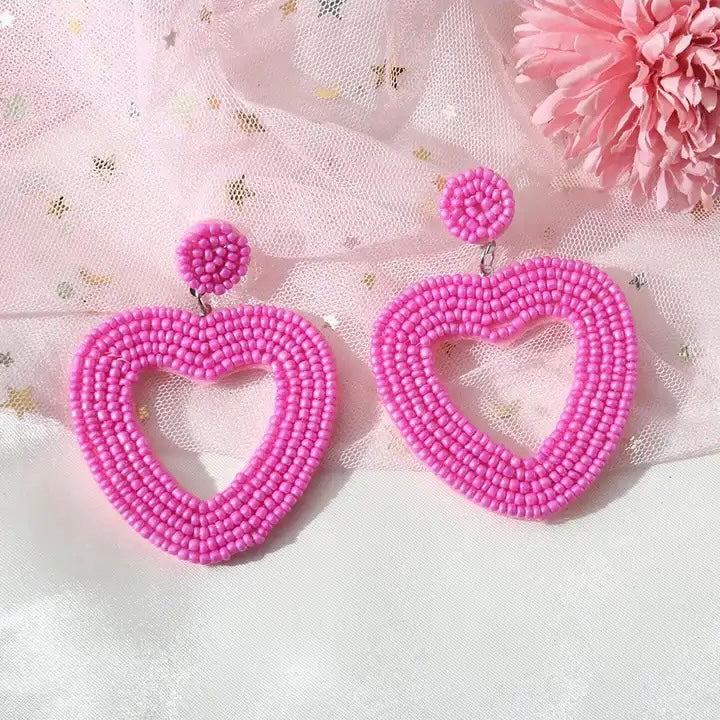 Aretes de corazones chaquiras rosa