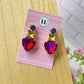 Aretes de corazón rosa y amarillo