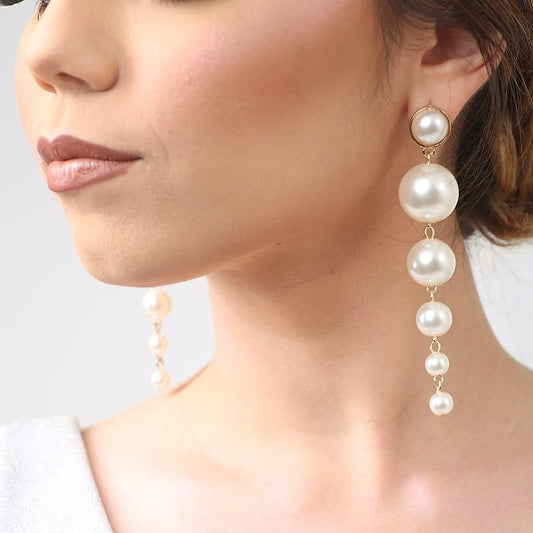 Aretes de perlas colgantes